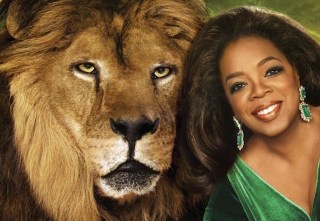 Illustration for article titled Here's Oprah Luxuriating Beside a Lion Because Oprah